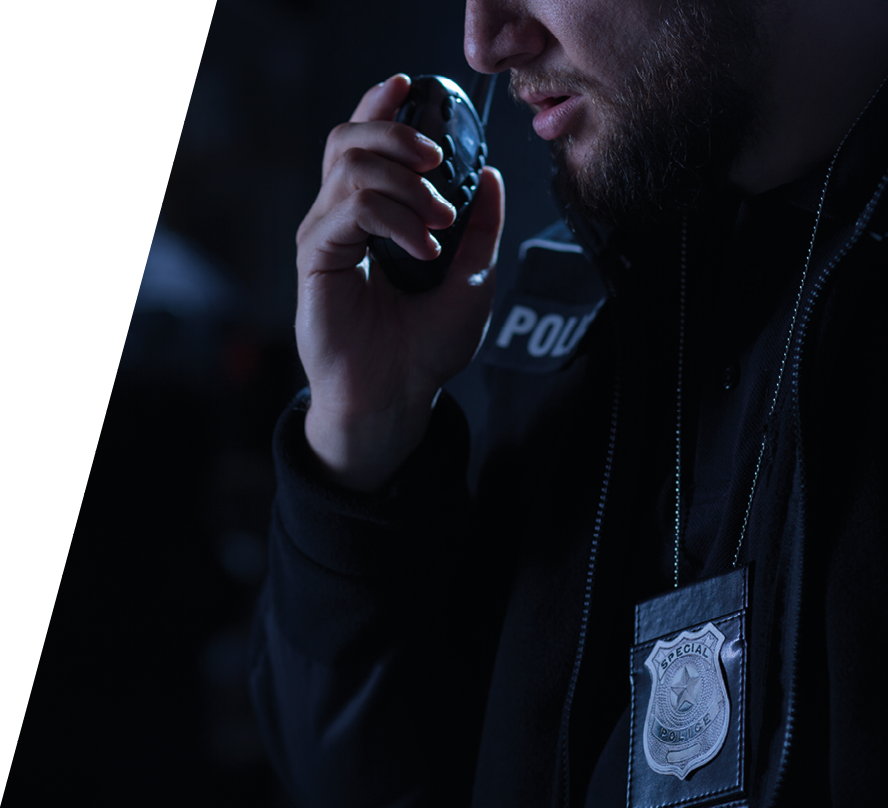 Officer using walkie talkie during police intervention