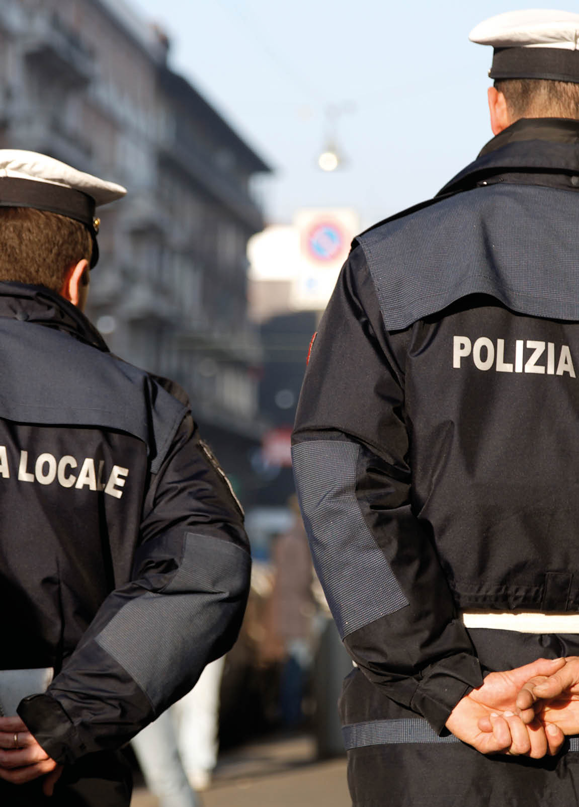 A pair of policemen on patrol in Italy. Selective focus.